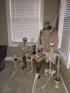 there are many skeletons sitting in the living room