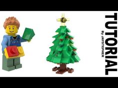 a lego christmas tree with a person holding a toy