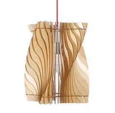 a wooden light fixture hanging from a red cord on a white wall in the shape of waves