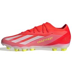 the adidas crazyfast soccer shoe is shown in red and white with yellow accents