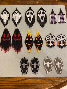 a collection of beaded halloween decorations on a table