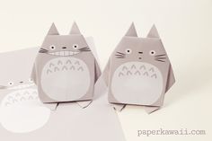 two paper animals are sitting next to each other