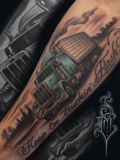 a man's arm with a truck on it and the words keep on trash