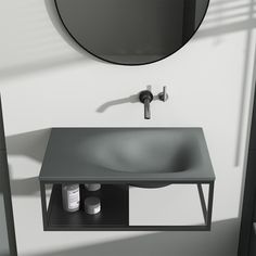 a bathroom sink sitting under a mirror next to a shelf