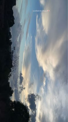 the sky and clouds are reflected in the water