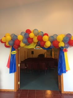 an entrance decorated with balloons and streamers