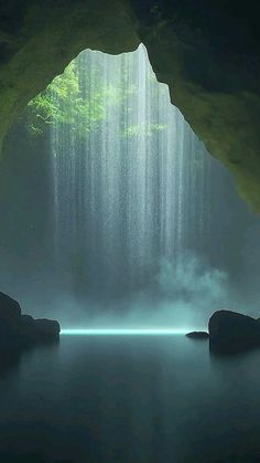 an image of a cave with water coming from the ceiling and sunlight streaming through it