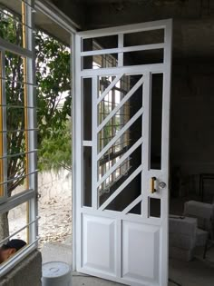 an open white door in front of a window