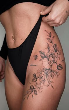 a woman's stomach with flowers on it