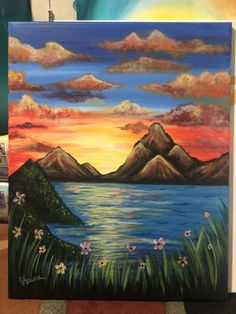 an acrylic painting of mountains and water at sunset