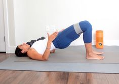 a woman is doing an exercise on a yoga mat