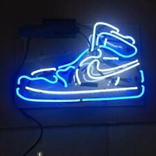 a neon sign that has a shoe on it