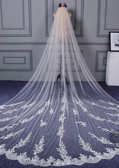 a wedding veil with flowers on it