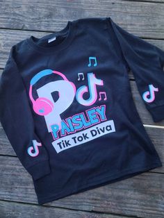 Do you, or do you know someone who LOVES Tiktok? Get them this cute custom Tiktok shirt! Available in long or short sleeve and youth or adult sizes. For YOUTH sizes see other listing. Please be sure to message name and custom text for shirt after ordering. Youth Shirt, Kids Graphic Tees, Adulting Shirts, Kids T Shirts, A Child, Kids Tshirts, Kids Outfits, Gender Neutral, Graphic Tees