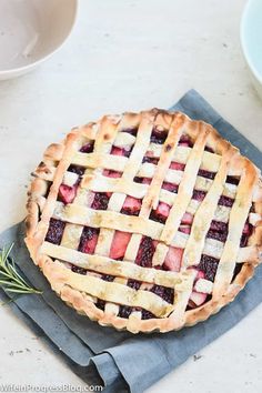 a pie sitting on top of a blue napkin