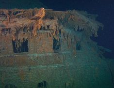 an old ship is covered in ice and icicles on the bottom part of it