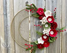 This stunning wreath would look fantastic on your door this holiday season! This wreath features a gold wreath base full of Christmas felt handmade blooms with berries and greenery! It's bigger measuring at 16 inches! Love this wreath but with different colors?  I have tons to choose from simply send me a convo! Would make a great birthday, Christmas, Mother's Day, new home, baby, bridal shower or wedding gift! Made in a smoke and pet free home! Love this wreath but want it a bit different?  I c Christmas Wreaths Felt, Christmas Felt Wreath, Felt Christmas Wreath, Felt Wreaths, Christmas Tree Base, Felt Flower Wreaths, Wreath Frames, Felt Flowers Diy, Felt Handmade