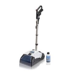 a blue and white floor scruber next to a bottle of cleaner