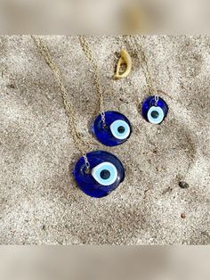 This Glass Evil Eye Necklace is more than just a piece of jewelry; it's a Symbol of Protection and Positive Energy. The intricately designed Big Glass Evil Eye Pendant captures attention and keeps Negative Vibes away. Encased in an exquisite jewelry box, it's a gift that's already dressed to impress, making it the perfect choice for her Christmas Surprise. #evileye #necklace #evileyenecklace #greekevileye #evileyejewelry #muranoevileye #muranonecklace #evileyenecklace #christmasgiftideas Round Glass Jewelry For Parties, Round Glass Party Jewelry, Blue Round Necklace For Birthday Gift, Spiritual Blue Jewelry For Birthday, Spiritual Blue Jewelry For Birthdays, Handmade Jewelry For Party Gifts, Handmade Jewelry For Parties And Gifts, Round Charm Necklace With Adjustable Chain Gift, Handmade Jewelry For Party And Gift-giving Occasions