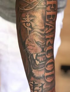 a man with a tiger tattoo on his arm