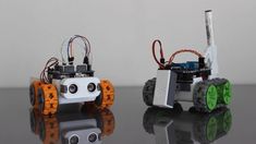 two robots that are sitting next to each other