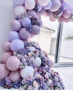 a tower made out of balloons and flowers