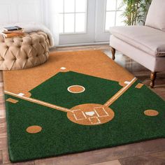 an area rug with a baseball field and ball on it in front of a couch