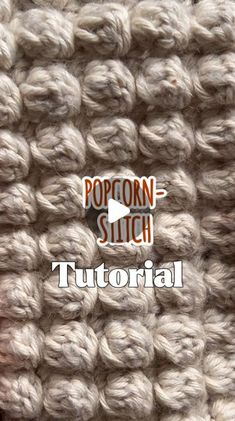 the popcorn stitch crochet pattern is shown in white and has an orange arrow on it