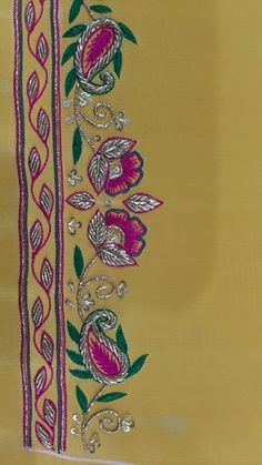 a piece of cloth with flowers and leaves on the side in pink, yellow and green