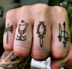 two fingers with different tattoos on them and one has a mirror, an arrow, and a bow