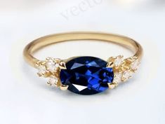 a blue ring with three stones on it