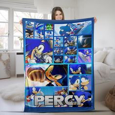 a woman holding up a blanket with sonic the hedgehog pictures on it