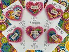 four valentine's day greeting cards with hearts and sayings on them, all decorated in bright colors