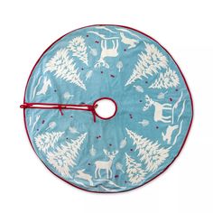 a blue and white christmas tree skirt with reindeers on it, hanging from a red hook