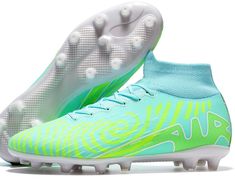 a pair of soccer shoes with blue and green colors