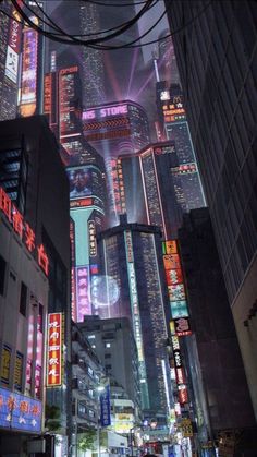 an image of a city at night with neon lights and skyscrapers in the background