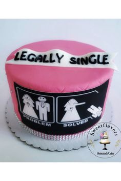 a pink and black wedding cake with the words legally single on it's side