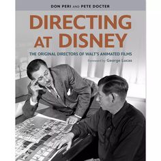 two men sitting at a table with a poster on it that says directing at disney the original director of walt's animated films