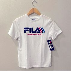 Boys/Youth White T-Shirt From Fila Round Neck Short Sleeves 50% Cotton, 50% Polyester Soft Fabric Machine Wash Cold Fila Shirt, White T Shirt, White Tshirt, White T, Lana Del Rey, Kids Shirts, Soft Fabric, Soft Fabrics, Shirts Tops