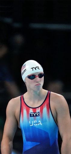 a man wearing a swimming cap and goggles