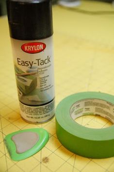 a can of krylon easy - tack tape next to a roll of tape