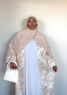 Design by HIJAB THRONE PRODUCT DETAILS; Nyla Cardigan Material: 100% Brocade Jacquard Belt Not See Through Model is wearing size 2XL TAKE CARE OF ME; Hands wash only / cool iron recommended to avoid damaging the fabric Please note that the color displayed in the picture might be slightly different due to color resolution and lighting. SIZE CHART SIZE CHEST WAIST LENGTH S 33 24 56 M 34 28 56 L 36 30 58 XL 38 32 58 2XL 40 33 59 Eid Brocade Sets In Floor-length, Floral Hijab Dress, Traditional Long Sleeve Embroidered Abaya, Brocade Abaya, Luxury Long Sleeve Abaya With Floral Embroidery, Event Dresses Classy, Elegant Embroidered Floor-length Abaya, Floral Hijab, Muslim Evening Dresses