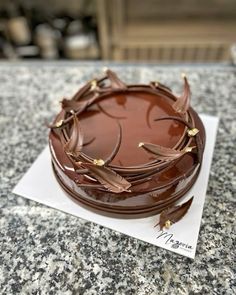 a chocolate cake sitting on top of a table