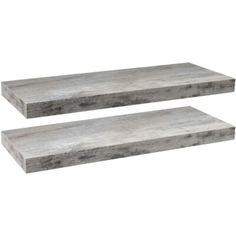 two gray stone shelves sitting next to each other on a white background and one is empty