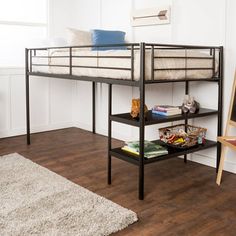 a bunk bed sitting on top of a wooden floor