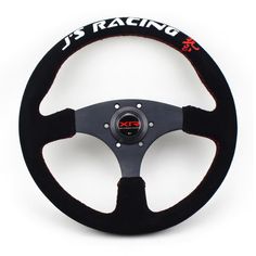 the steering wheel is black with red stitchs and white lettering that reads j s racing