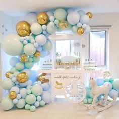 a room decorated with balloons and decorations