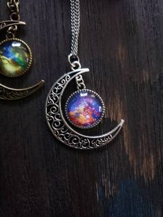 "Nebula witchy moon necklace with your choice of Nebula style. Choose from style 1, 2 or 3 and your choice of silver or bronze finish, as well as your choice of length. ➳ Moon measures approximately 2\"x2\". ➳ Reference photo chart to determine the length that suits you. ➳ Bronze chain is lead free metal alloy. ➳ Silver chain is stainless steel and suitable for those with allergies to certain metals. ̩̩͙�✩*̩̩͙*˚＊ ̩̩͙✩*̩̩͙*˚＊ ̩̩͙✩*̩̩͙*˚＊ ̩̩͙✩*̩̩͙*˚＊ ̩̩͙✩*̩̩͙ 🌙 The Lunarly Lotus is a new shop but Nebula Necklace, Witchy Necklace, Galaxy Necklace, Necklace Moon, Celestial Necklace, Hippie Necklace, Necklace Boho, Moon Necklace, Boho Necklace