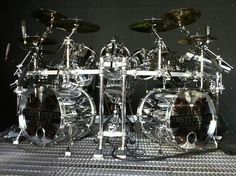 a drum set sitting on top of a metal floor