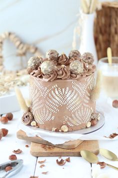 there is a cake with chocolate frosting and nuts on it